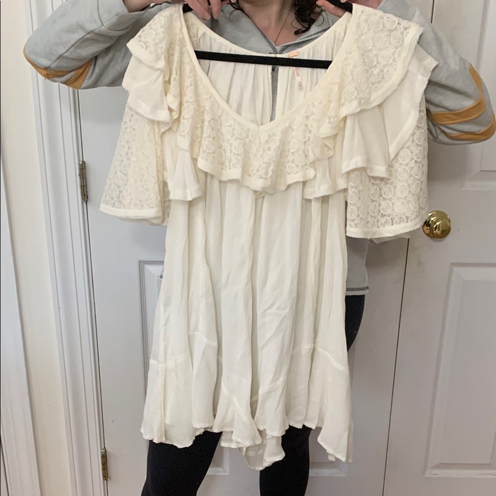 - Free People Elegant Cream Ruffle romper